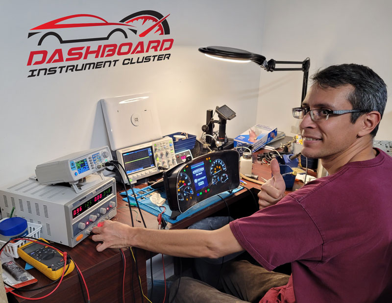 Person repairing an Instrument Cluster